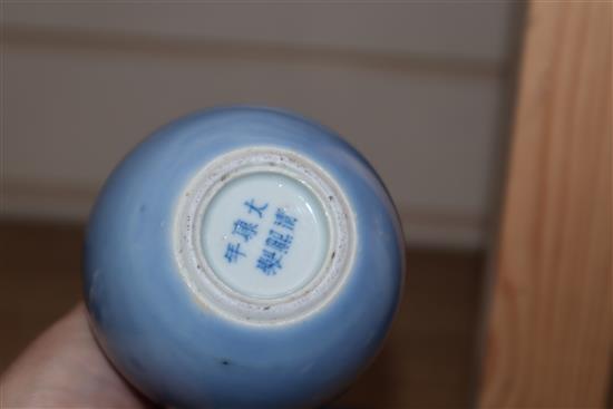 A Chinese blue glazed bottle vase, Kangxi mark but Republic period and a Chinese pottery figure tallest 12cm